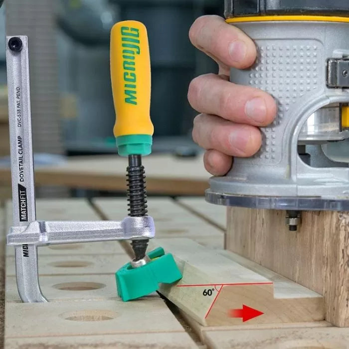 Woodworking router and MATCHFIT dovetail clamp fixing an angled wooden piece on a workbench.