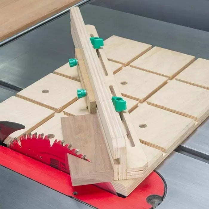 Table saw crosscut sled jig with adjustable wooden fence and wood piece in cutting position