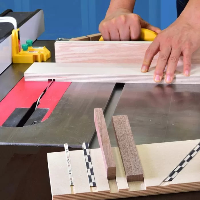 Woodworker using table saw sled to cut precise grooves in wood with inlay strips