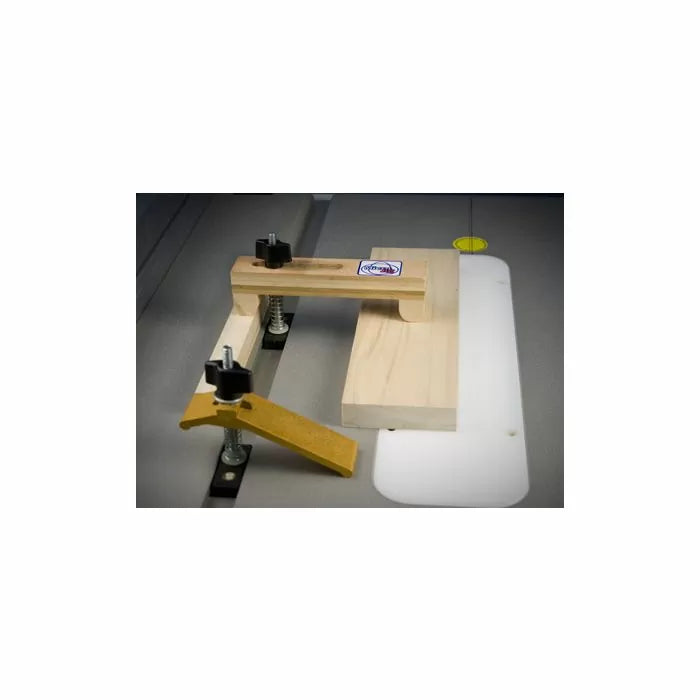 Woodworking table saw jig with clamps for secure cutting and precise alignment