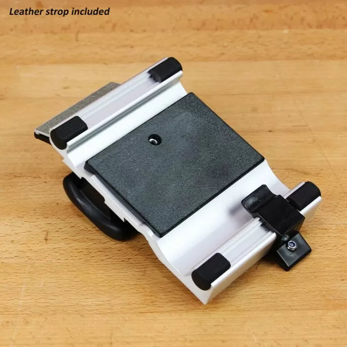 Adjustable woodworking honing guide for sharpening tools on wooden workbench
