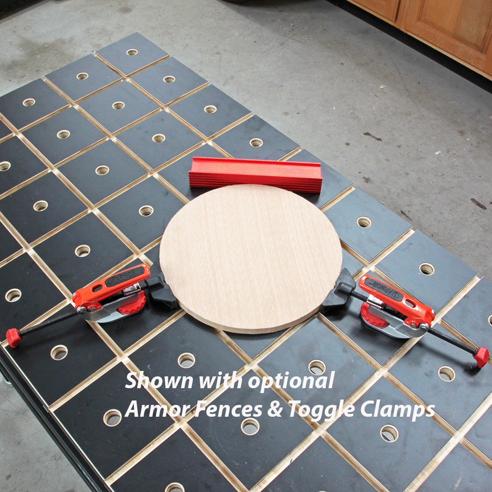 Woodworking workbench with grid holes, red clamps, round wood piece, and red fences