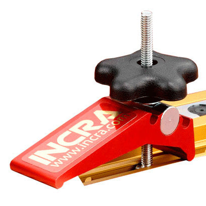 Precision miter gauge accessory with red clamp and black adjustment knob for woodworking tools