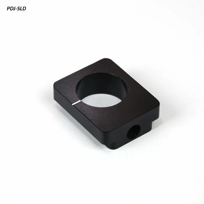 Black square jig stop block for woodworking tools, precision machined, on white background.