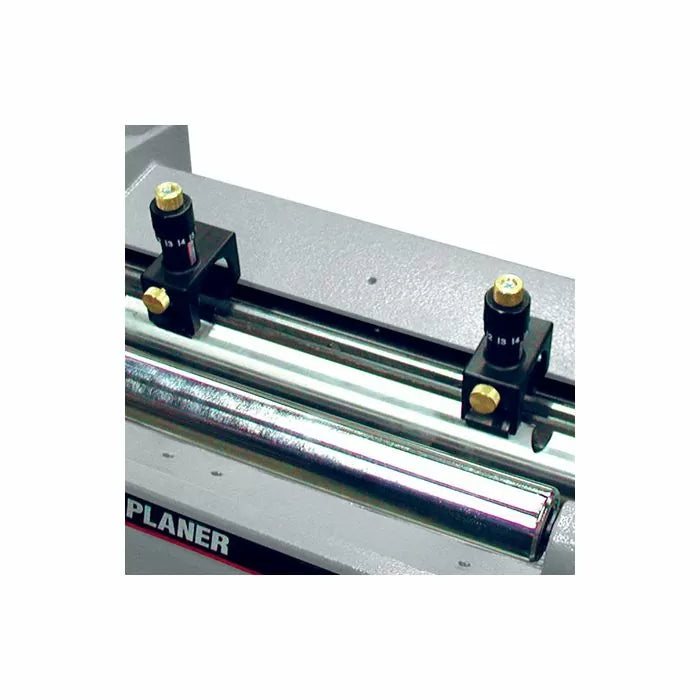Planer gauge setup tool attached to a woodworking planer for precise blade alignment
