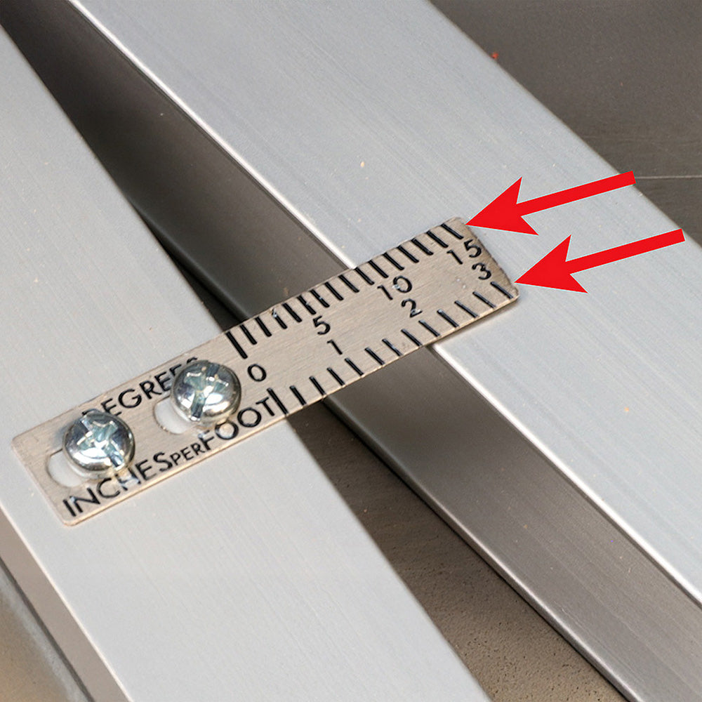 Close-up of a metal angle gauge with measurement markings and degree scale for woodworking.