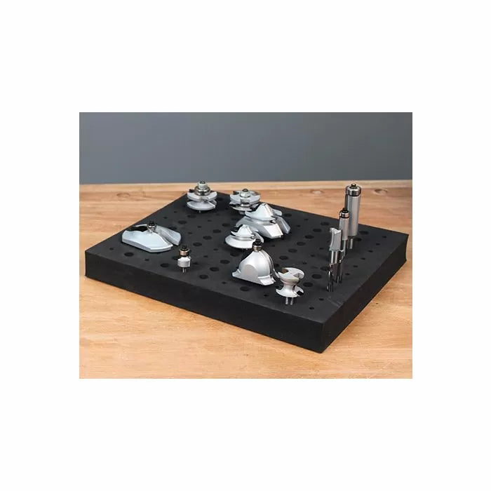 Router bits set displayed on a perforated foam tray for woodworking tool organization.
