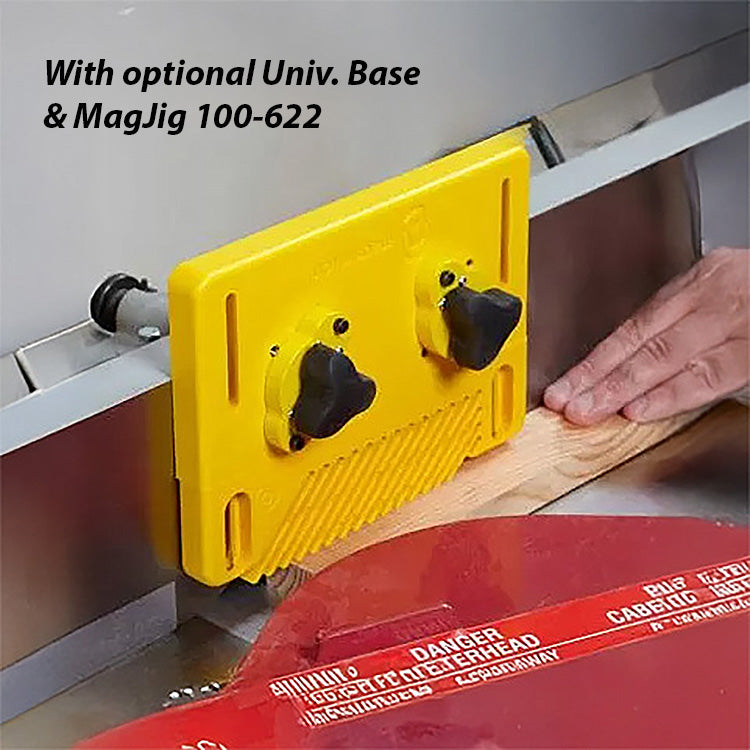 Yellow featherboard with knobs mounted on a table saw fence guiding wood for safe cutting