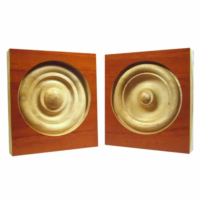 Pair of square hardwood rosette blocks with concentric circle details for woodworking