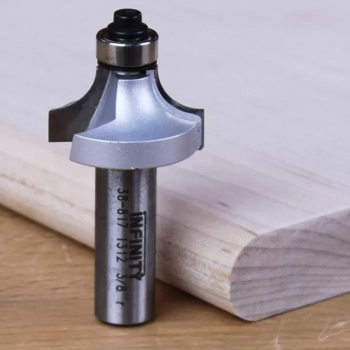 Roundover router bit for woodworking shown next to rounded wood edge