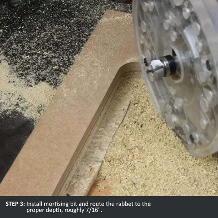 Close-up of a router cutting a rabbet joint in MDF wood with sawdust visible, woodworking tools in use.
