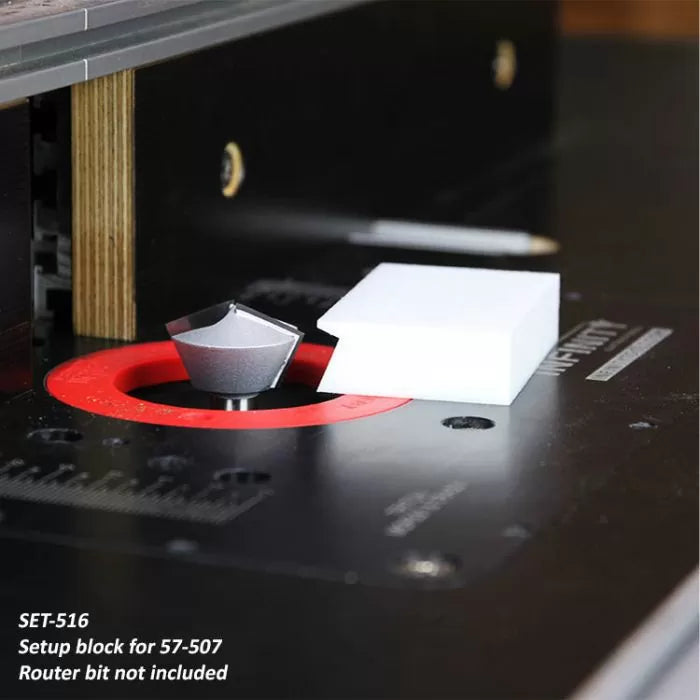 Setup block for router table height adjustment, shown beside a router bit on a black work surface.
