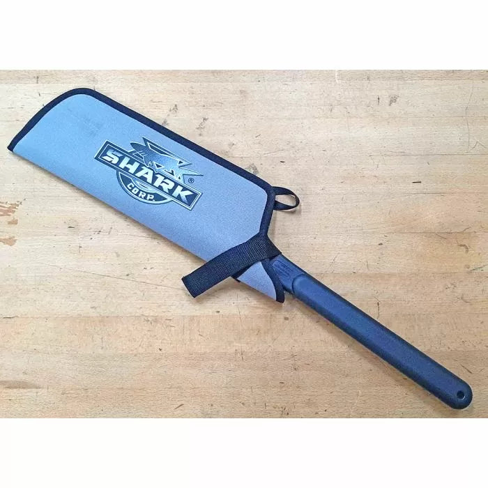 Hand saw with protective Shark Corp blade cover on wooden workbench