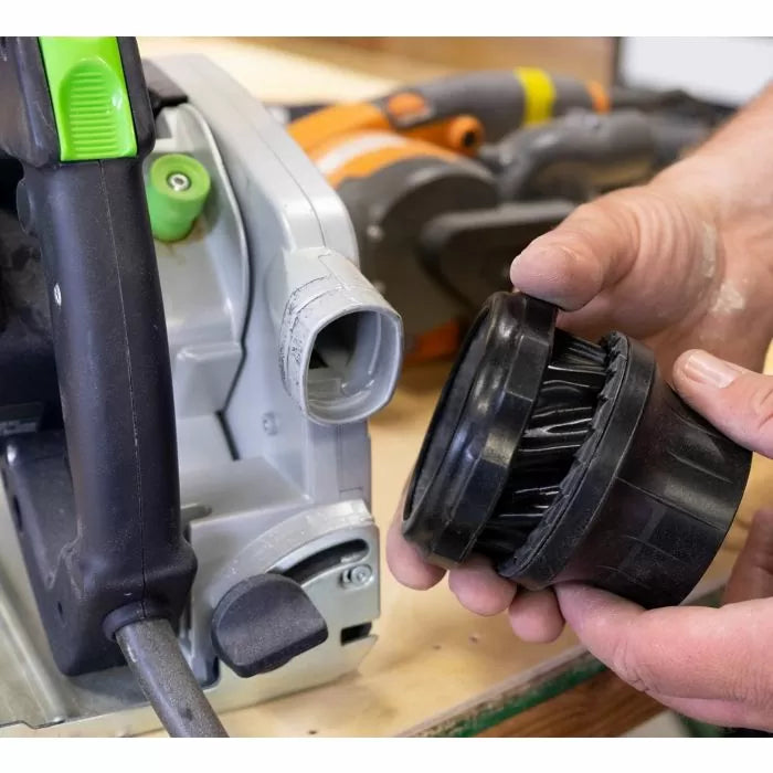 Universal vacuum adapter for woodworking power tool dust collection held by hands