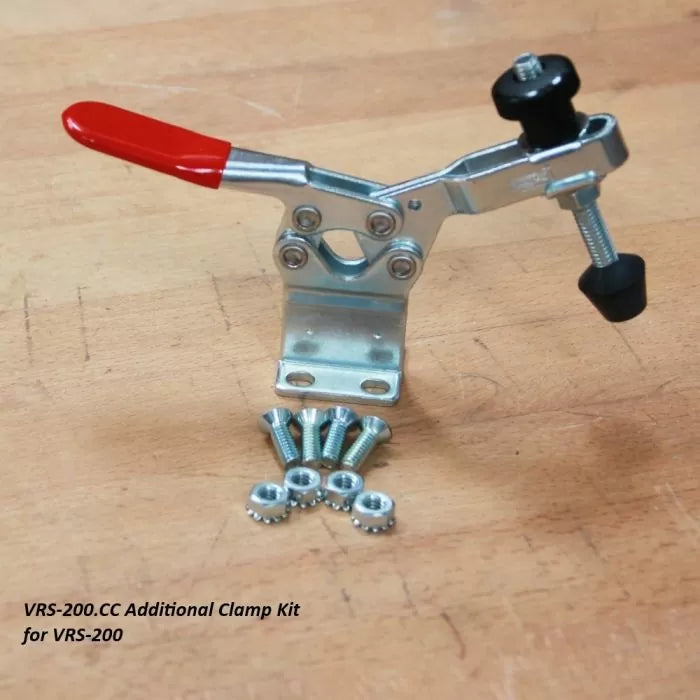 VRS-200.CC toggle clamp kit with red handle, mounting screws, and nuts on wood surface