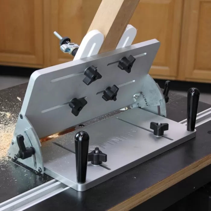 Adjustable woodworking jig for precise angle cutting on a router table, showing rear view