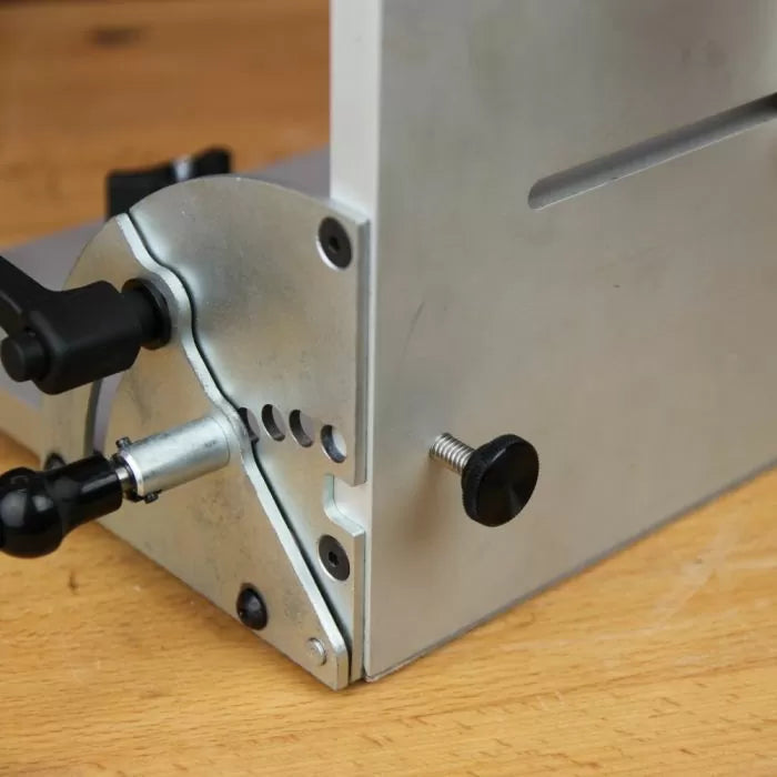 Detail of spring-loaded pin and positive stops on precision woodworking tool jig
