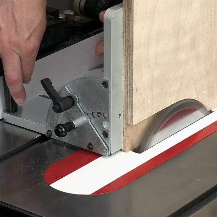 Table saw crosscut sled guiding plywood board for precise woodworking cuts