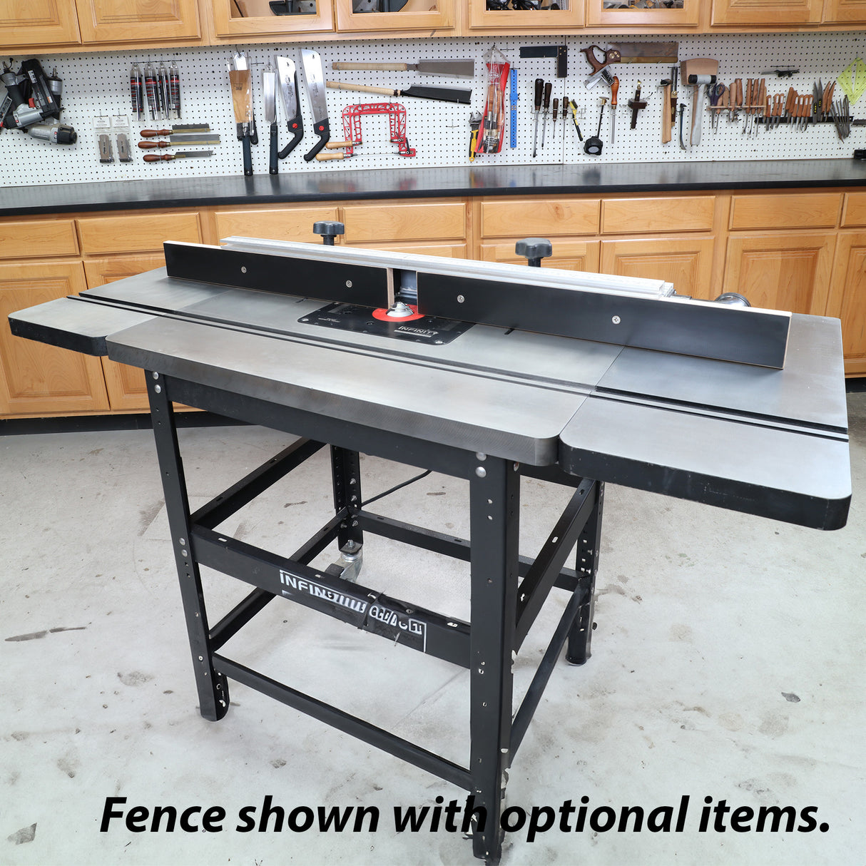 Woodworking router table with fence and extension wings in a workshop setting