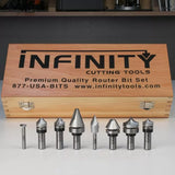 Woodworking router bit set with various profiles displayed in front of a wooden storage case.