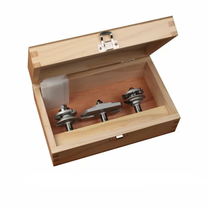 Three carbide router bits in a wooden case for woodworking and joinery.
