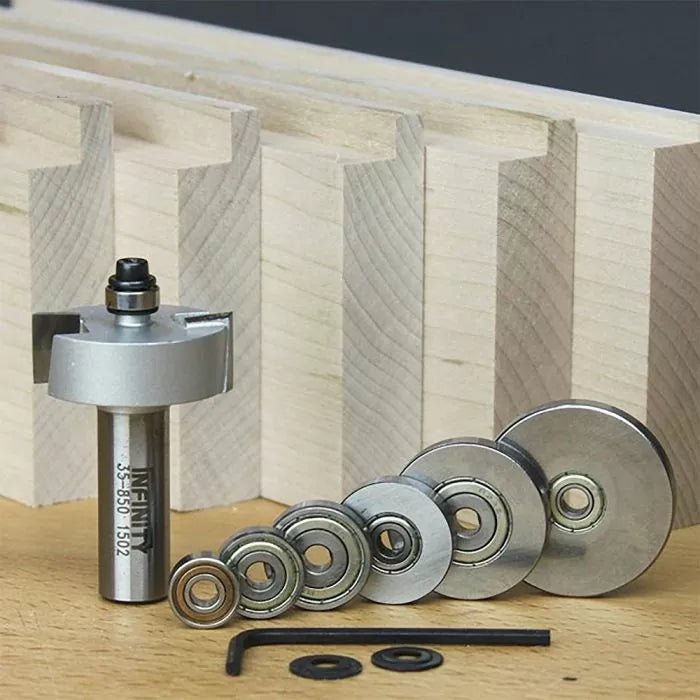 Router bit set with multiple bearings, allen wrench, and jigs for woodworking joinery cuts.