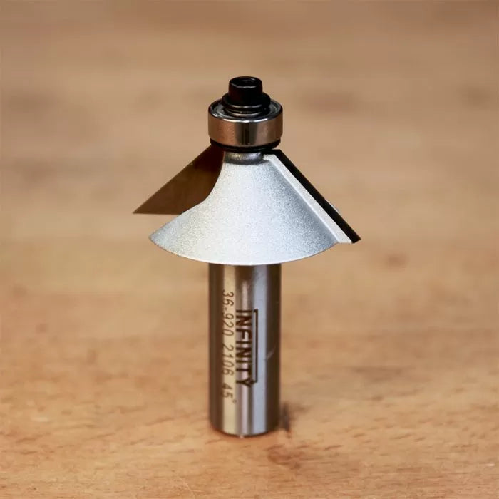 Chamfer router bit with bearing on wooden surface, woodworking tool for clean angled edges