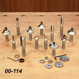 Router bit set with bearings and tools on a wooden workbench, woodworking tool kit 00-114.