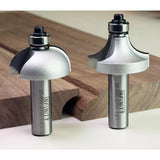 Two roundover router bits on wood, woodworking tools for smooth edge routing