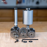Woodworking router bits and bearings set with wrench and washers on workbench
