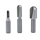 Set of three carbide-tipped router bits for woodworking, isolated on white background