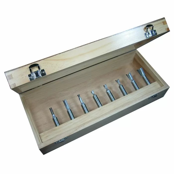 Wooden box with eight woodworking router bits neatly arranged inside