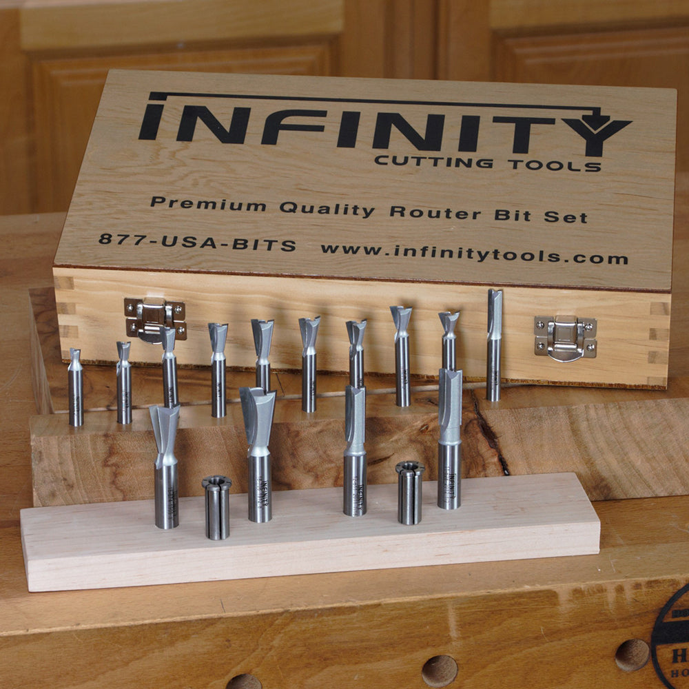 Router bit set with wooden storage case on workbench, ideal for woodworking precision.