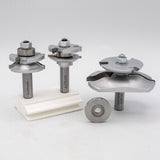 Carbide-tipped router bits set with ball bearing, for woodworking joinery, on white background.