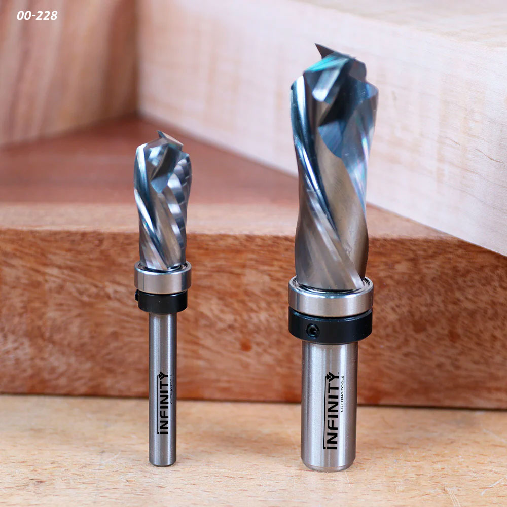 Two carbide surfacing router bits for woodworking on a wooden background