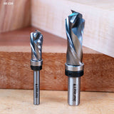 Two carbide surfacing router bits for woodworking on a wooden background