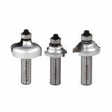 Three metal router bits for woodworking with ball bearing guides on a white background.