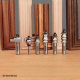 Set of woodworking router bits for decorative edge profiles, displayed with wood frames.