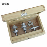 Router bit set in wooden box, four woodworking bits displayed neatly, code 00-523 visible.