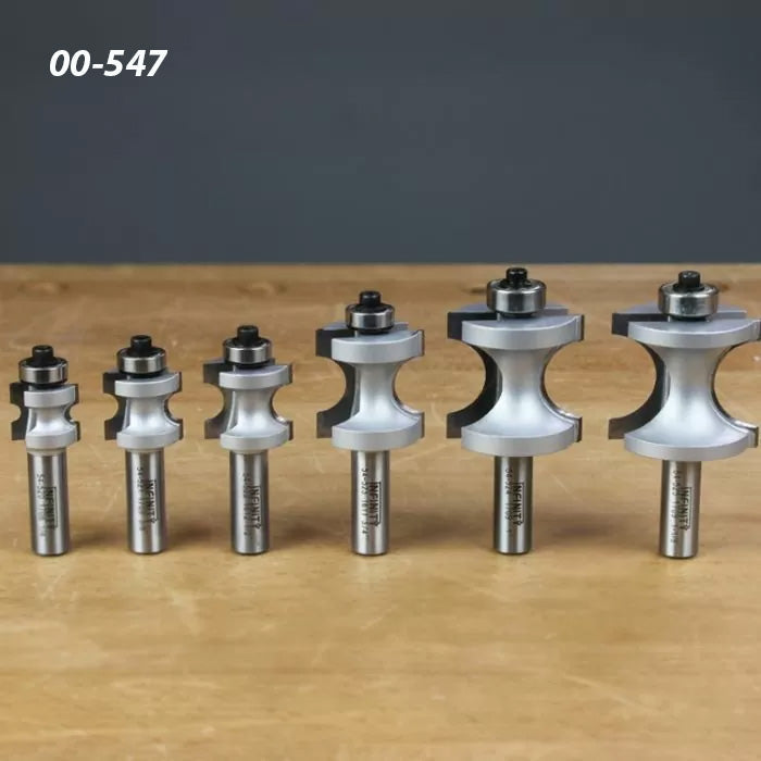 Set of six roundover router bits with bearings for woodworking on a wooden tabletop