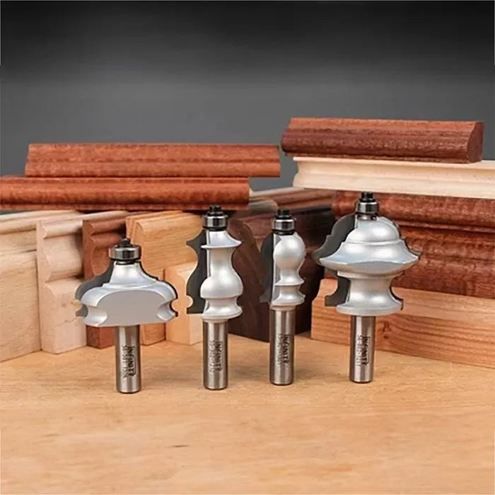 Decorative woodworking router bits with various profiles in front of wood trim samples