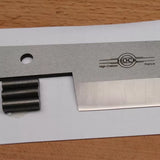High carbon steel woodworking plane blade with sharp edge on wood surface