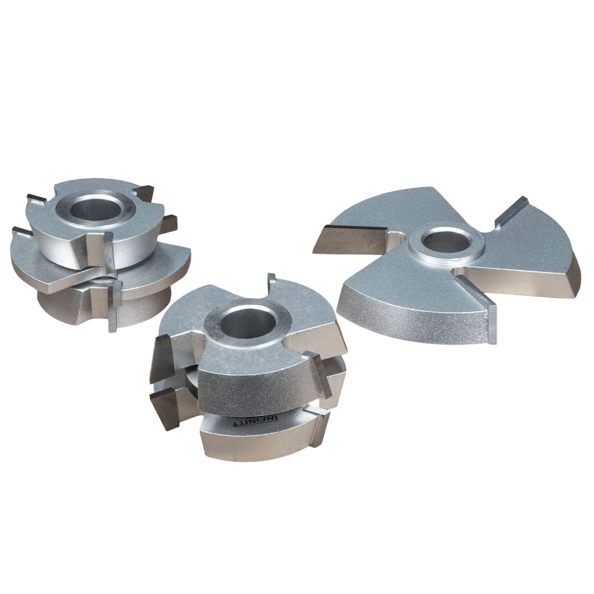 Shaper cutter set for woodworking, three steel router bits on white background