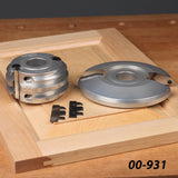 Woodworking shaper cutters and knives on a wooden panel, ideal for professional joinery.