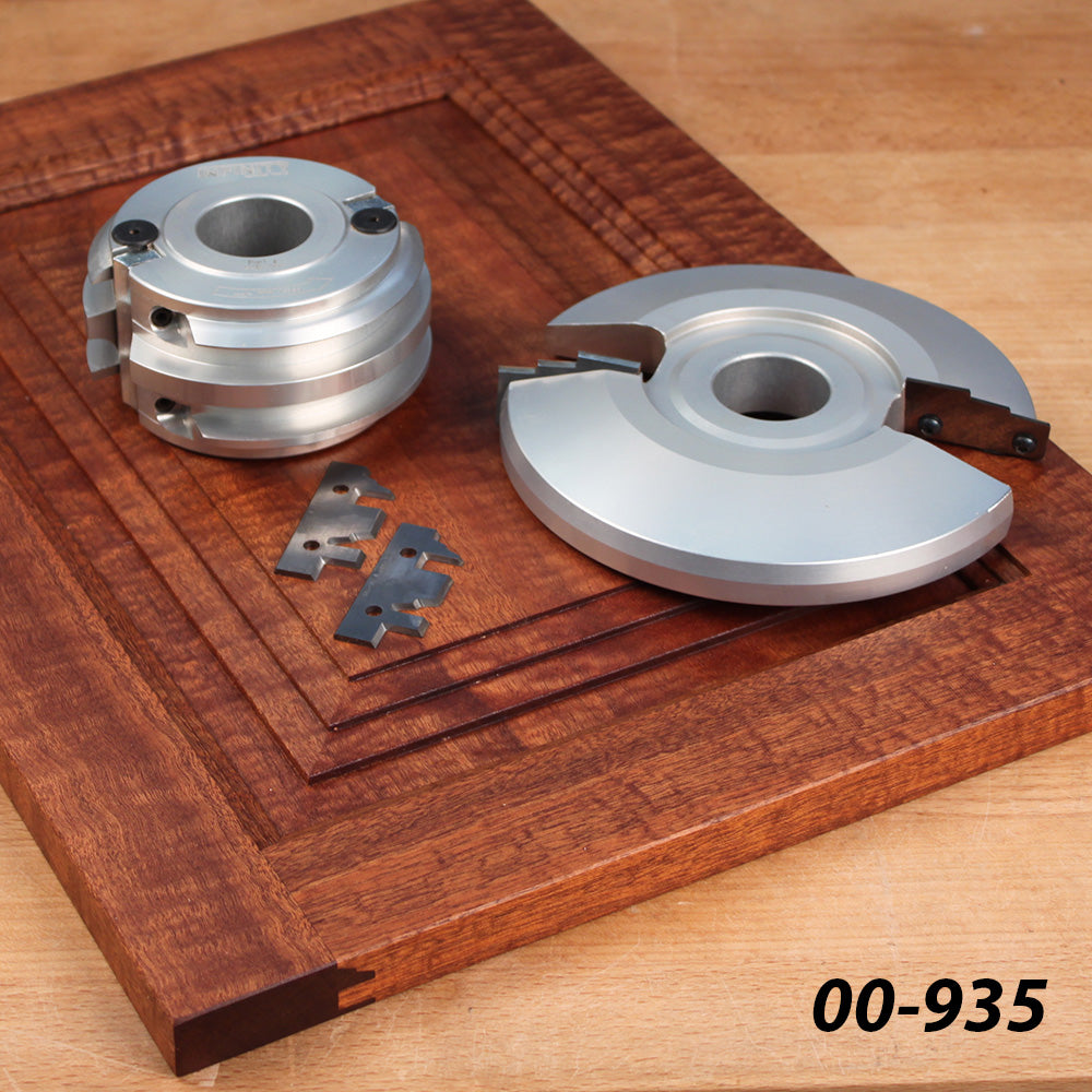 Woodworking molding cutter set with carbide inserts on a router-cut wooden panel