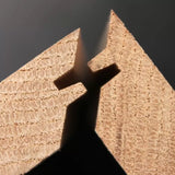 Close-up of two interlocking wooden dovetail joints for woodworking joinery