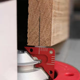 Router table setup with alignment tool and wood block for precise woodworking