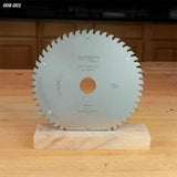 Circular saw blade with sharp teeth on wooden table, woodworking tool for precise cutting
