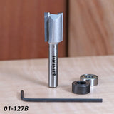 Woodworking router bit set with bearings, hex key, and straight carbide cutting tool on a table