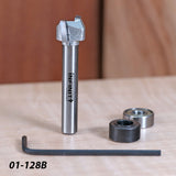 Carbide woodworking router bit with bearings, hex key, and model 01-128B on workbench